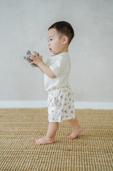 Toddler Boy Wearing Avauma Fluffy Garden Cream Rose Baby Shorts, Soft and Breathable Floral Summer Shorts